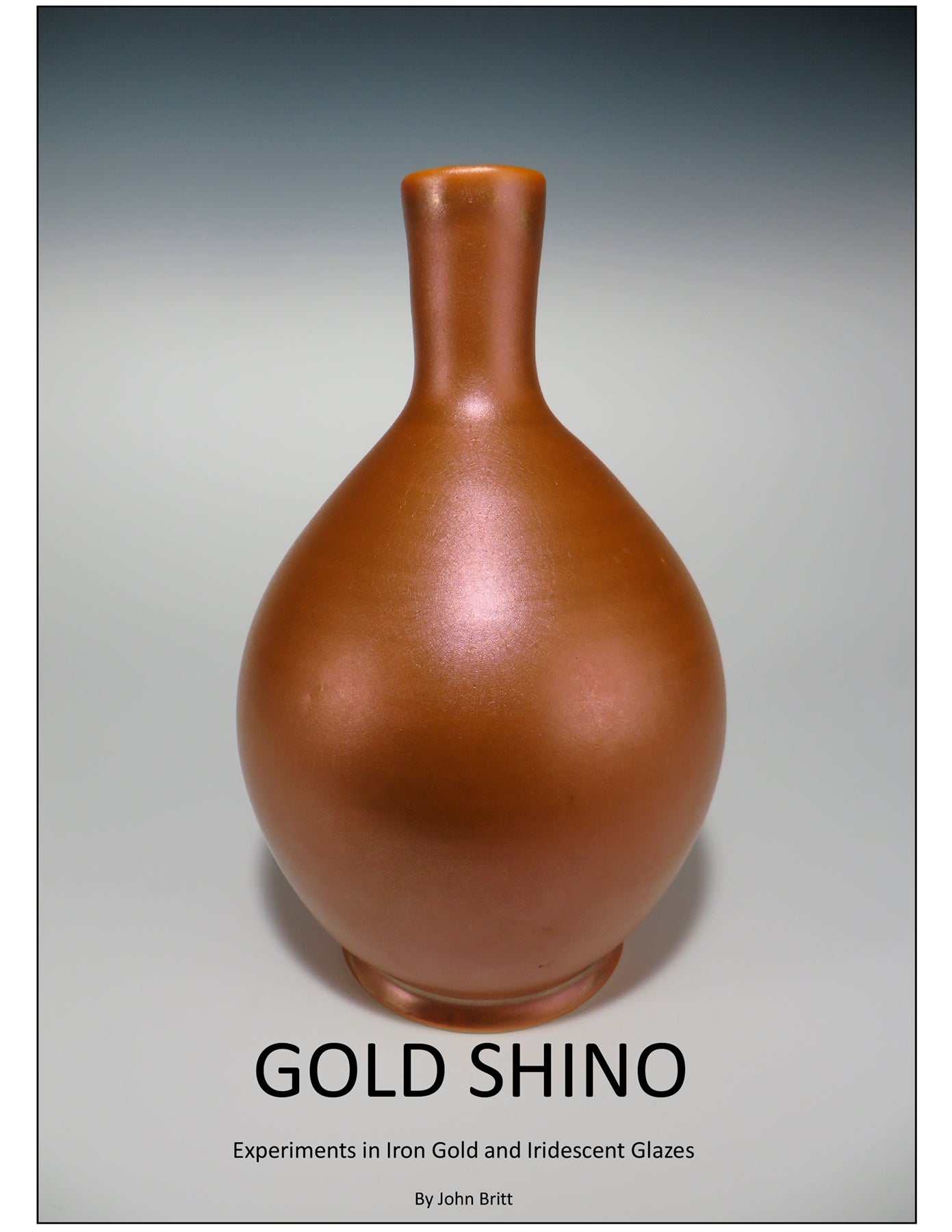 Ceramic vase with gold shino glaze on a gray background