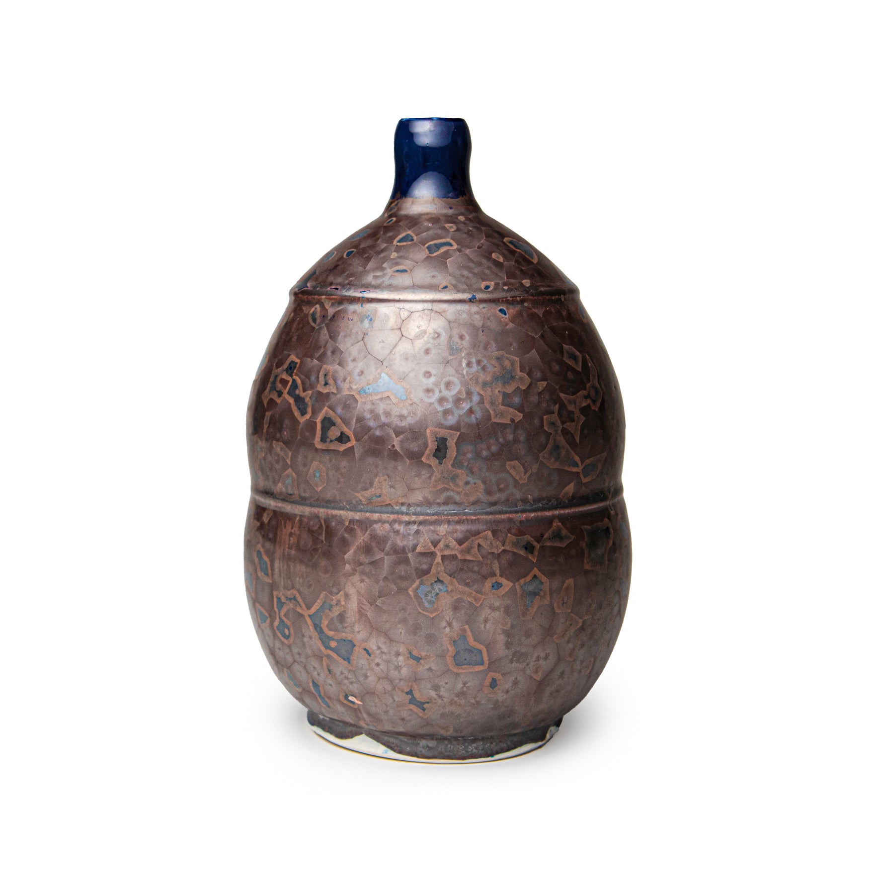 Decorative John Britt ceramic jar with intricate patterns on a white background