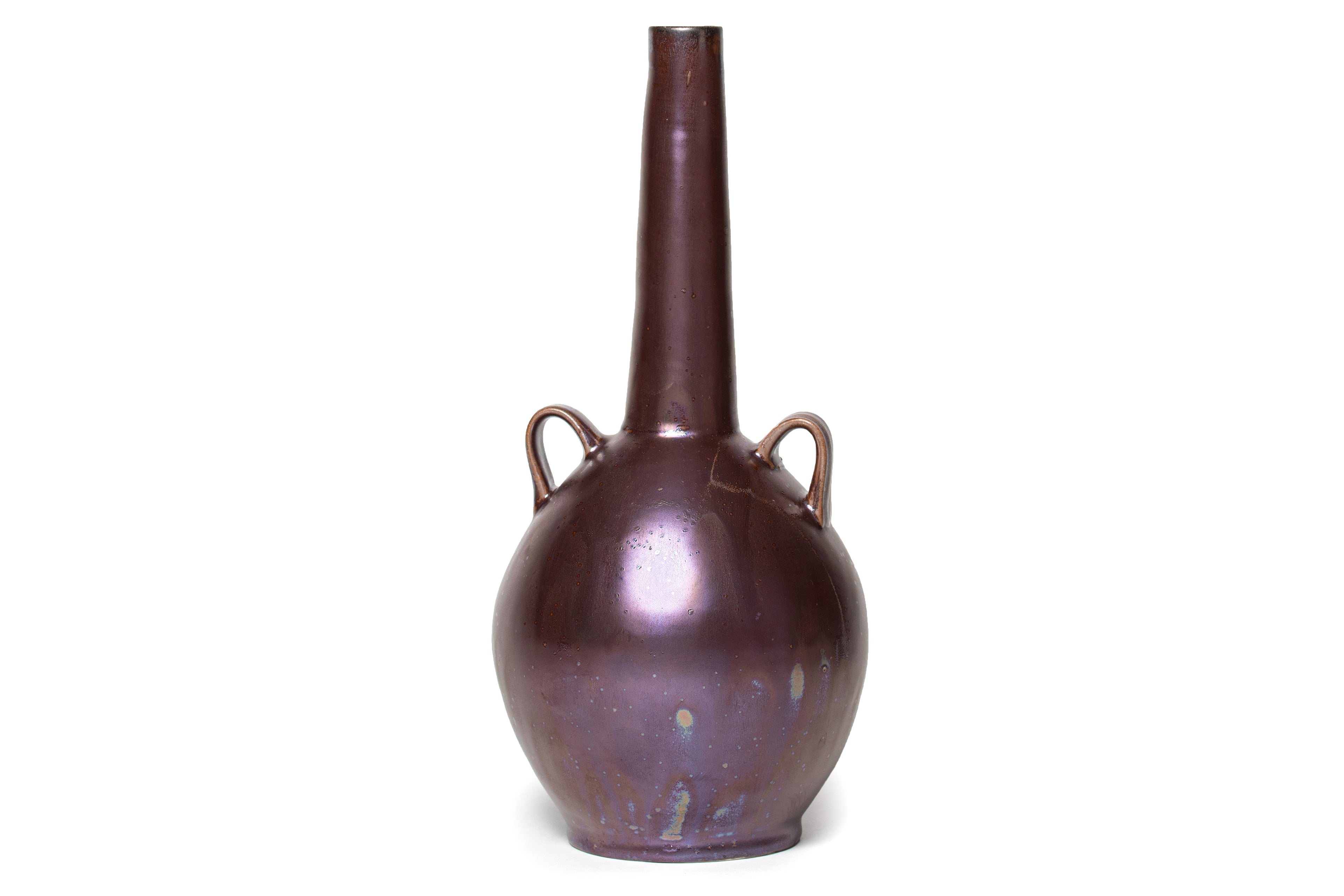 An iridescent ceramic vase by John Britt with a long neck and two handles on a white background