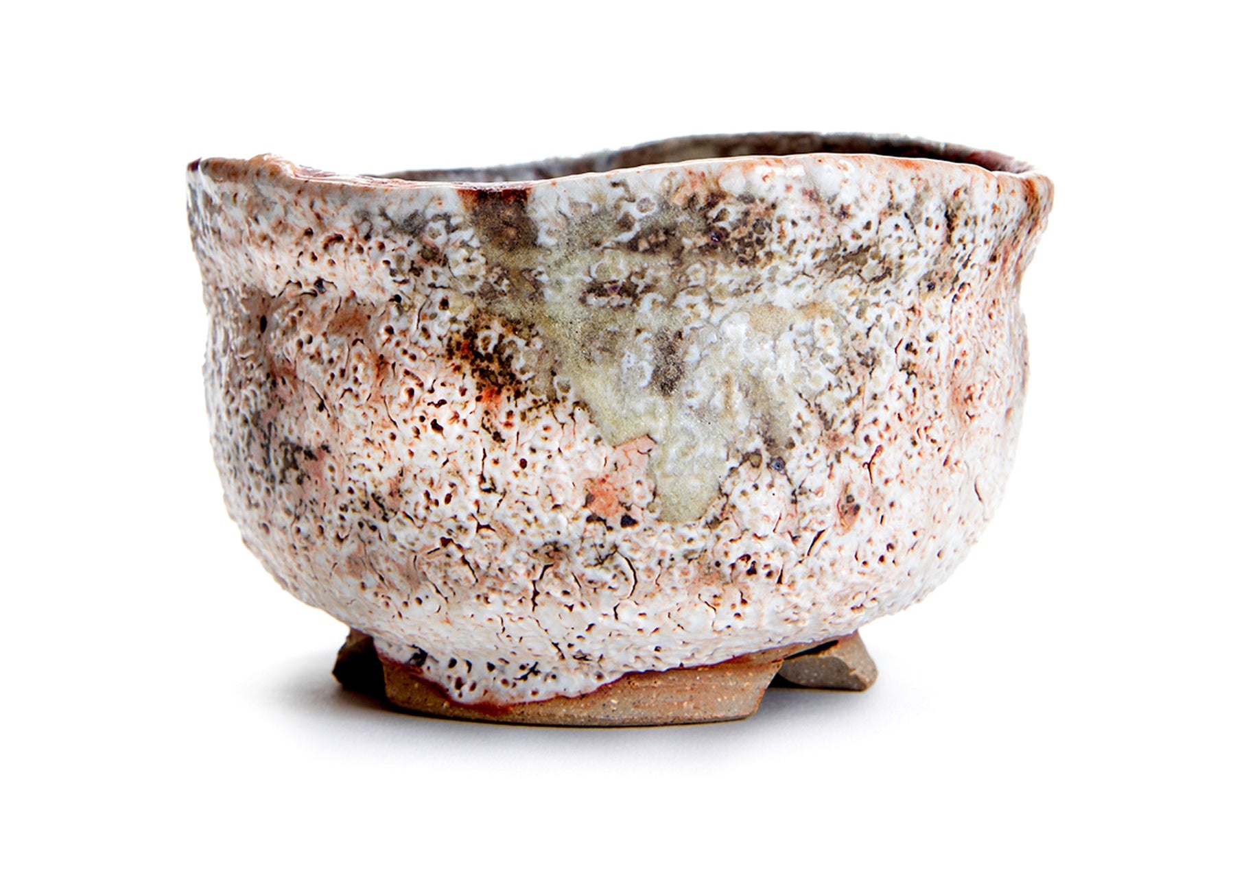 Speckled ceramic John Britt bowl on a white background